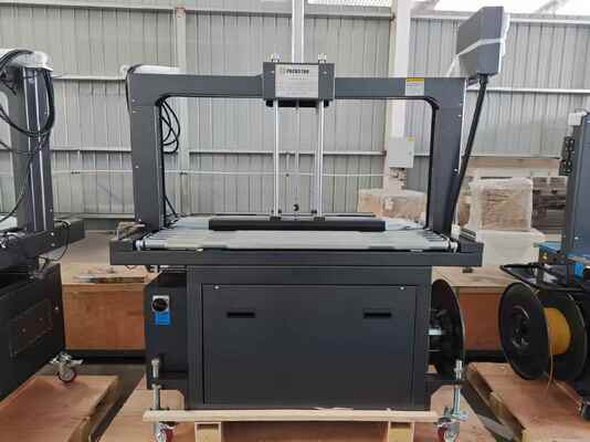 品質  Semi-Automatic 1200mm Carton Box Strapping Machine with One Year Warranty for Efficient Packing 工場